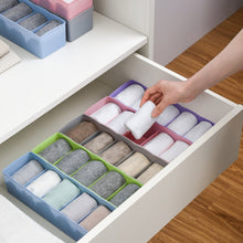 Clear plastic bead storage tray with multiple compartments for easy organization.