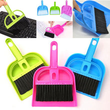 Efficient small broom and dustpan for household cleaning.