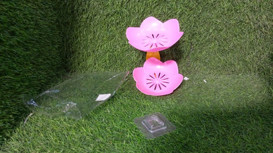 Self-draining soap dish with floral design, ideal for keeping soap dry in bathroom or kitchen.